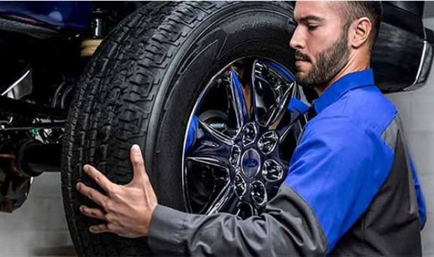 Technician Fixing a car tire