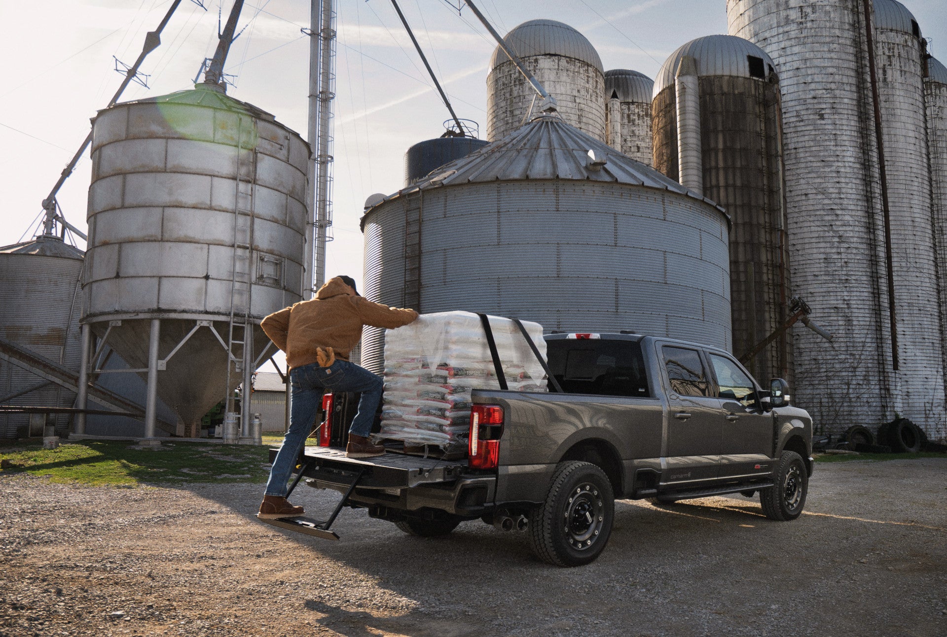 The 2027 Ford Super-Duty being loaded near grain silos