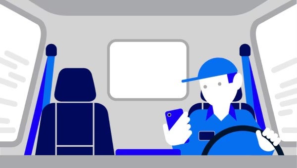 Man driving while looking at phone.