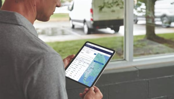 Man Checking out some data in Tab
